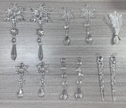 Ten clear acrylic icicle Christmas tree ornaments with hanging holes and white ribbon on pine branches