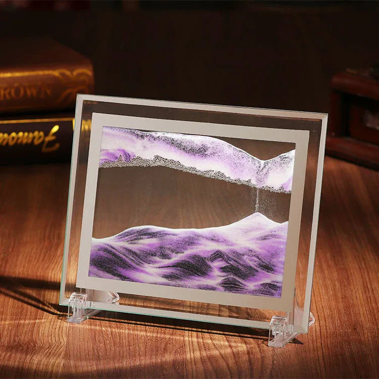 Geometric glass ornament containing a colourful quicksand landscape painting in modern style.