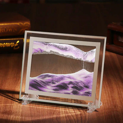 Geometric glass ornament containing a colourful quicksand landscape painting in modern style.