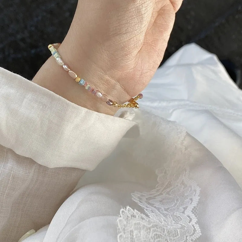 14K gold-plated purple natural pearl bracelet and necklace set with irregular mini pearls, featuring U-shaped design and manual craftsmanship for a distinctive, natural look