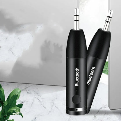 Black Bluetooth audio receiver with 3.5mm AUX jack for connecting to car stereos