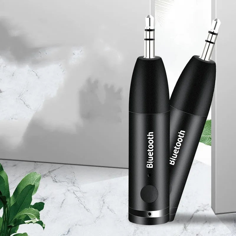 Car AUX Bluetooth Audio Receiver for wireless music streaming and hands-free calling with 10-metre range and 5-hour battery, connecting older car stereos or home systems via 3.5mm AUX input using Bluetooth 5.0 technology in black
