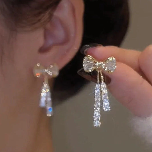 Elegant gold bow diamond crystal earrings for women, perfect for adding a touch of glamour to any outfit.