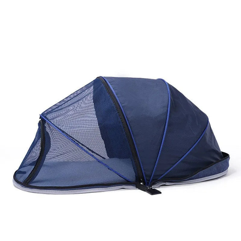 Black and blue half mesh portable folding tent for cats on a grey background.