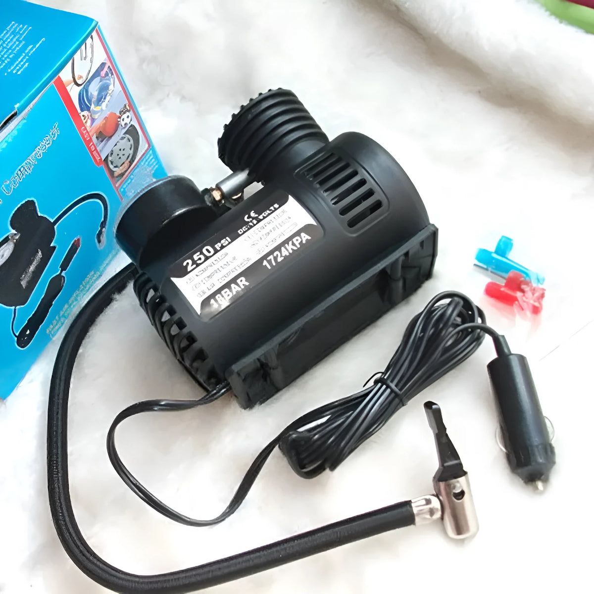 Black 12V mini car tyre air pump measuring 13.5x12x7cm with factory direct specifications