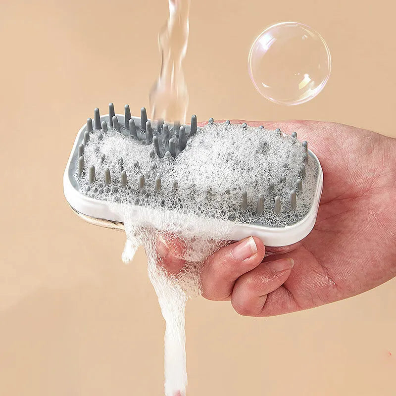 Pet silicone massage bath brush for dogs and cats, dual-use shower scrubber with soft flexible bristles for cleaning, de-shedding, and lathering foam during wash time, available in grey and pink.