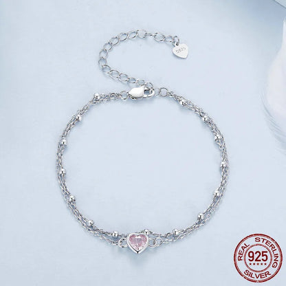 Sweet girlish sterling silver bracelet with a small heart charm on an adjustable chain.