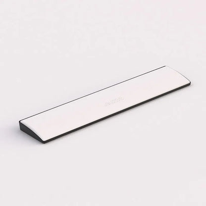 Black gaming keyboard wrist rest for a 104-key mechanical keyboard on a desk