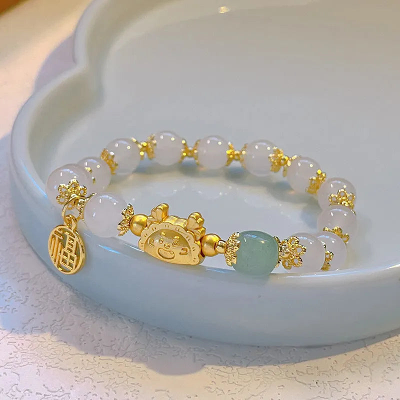 Electroplated glass coloured glaze zodiac bracelet for women showing zodiac animal modelling details