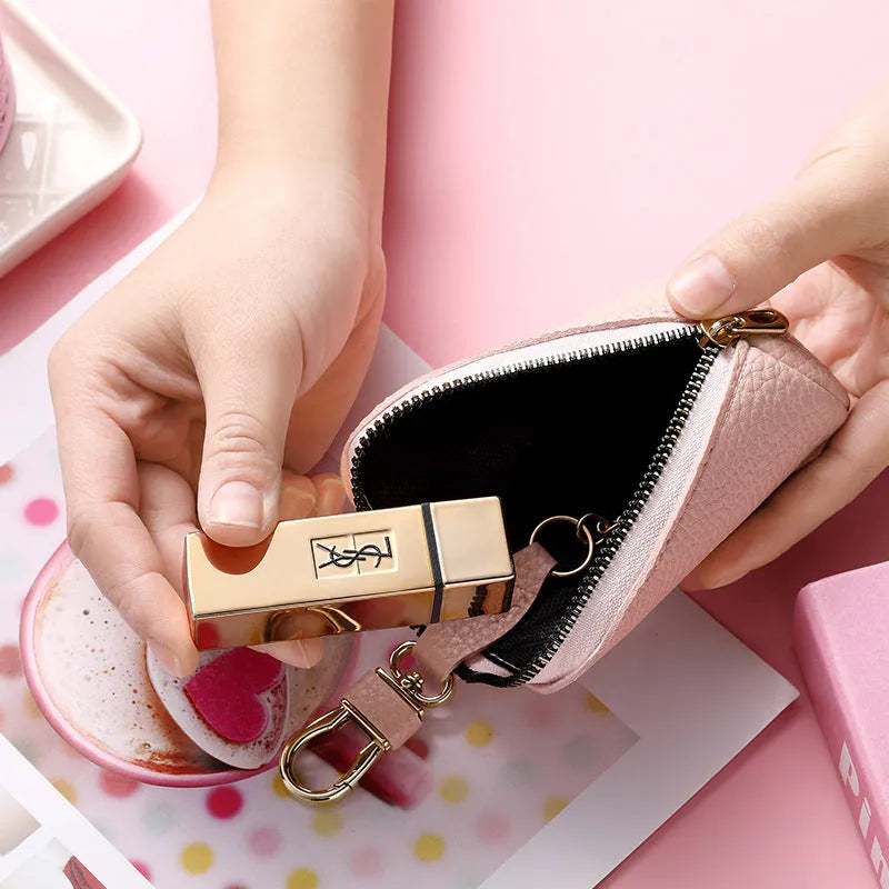 Minimalist black PU leather key wallet with a silver metal zipper closure.
