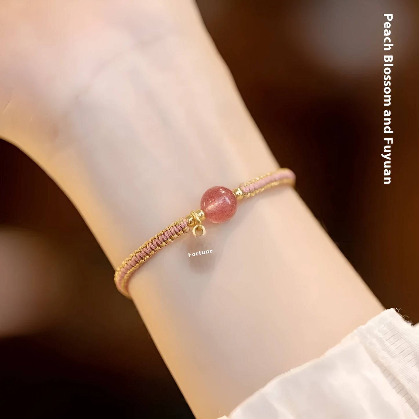 Adjustable red rope bracelet with transfer beads in Strawberry Quartz style on a wrist.