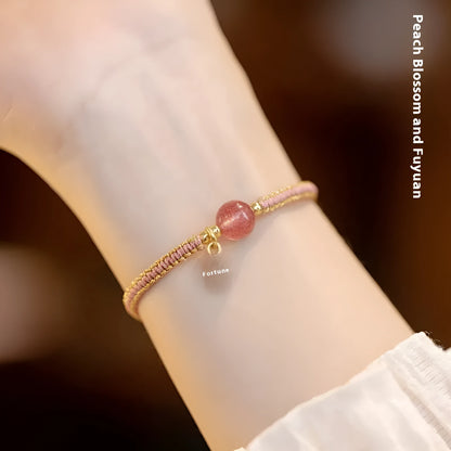 Adjustable red rope bracelet with transfer beads in Strawberry Quartz style on a wrist.