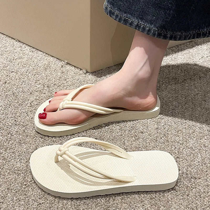 Men's PVC toe-covering flip-flop slippers on a white background, showing the injection moulded sole and available colour options.