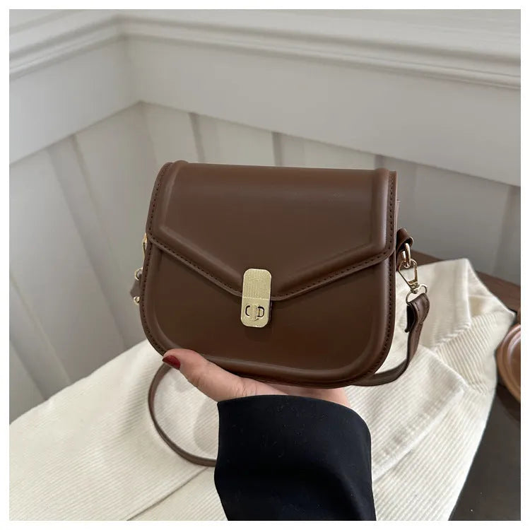 Soft PU leather messenger bag with textured finish in horizontal rectangular shape