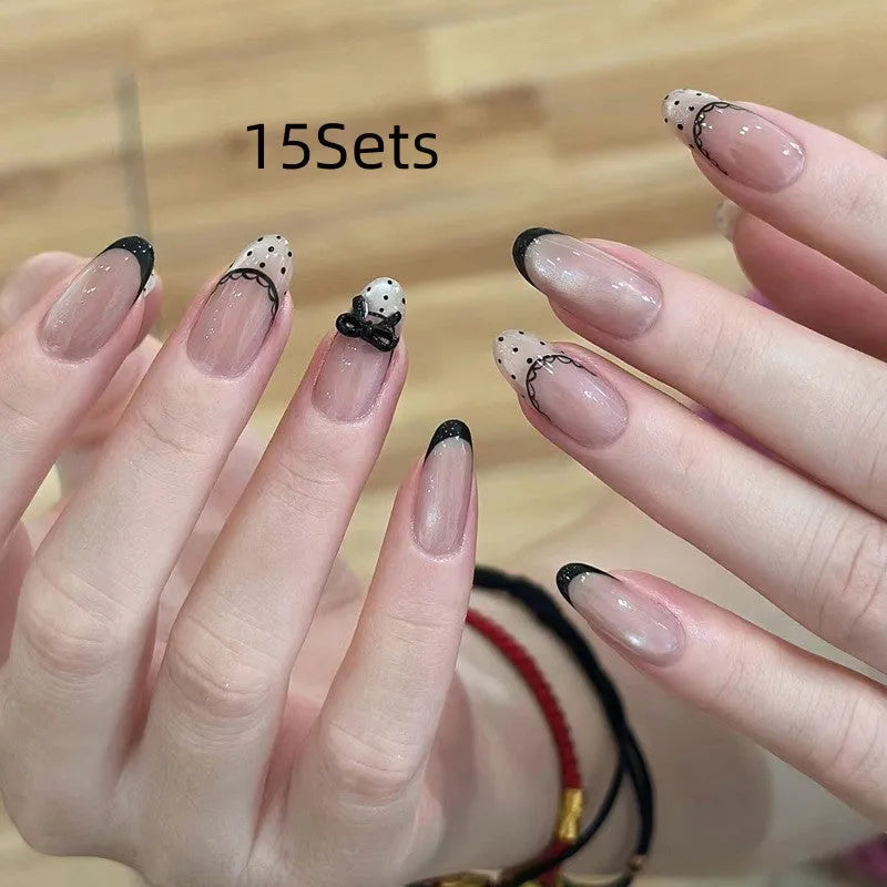 Five packs of reusable coloured false fingernails with various designs.