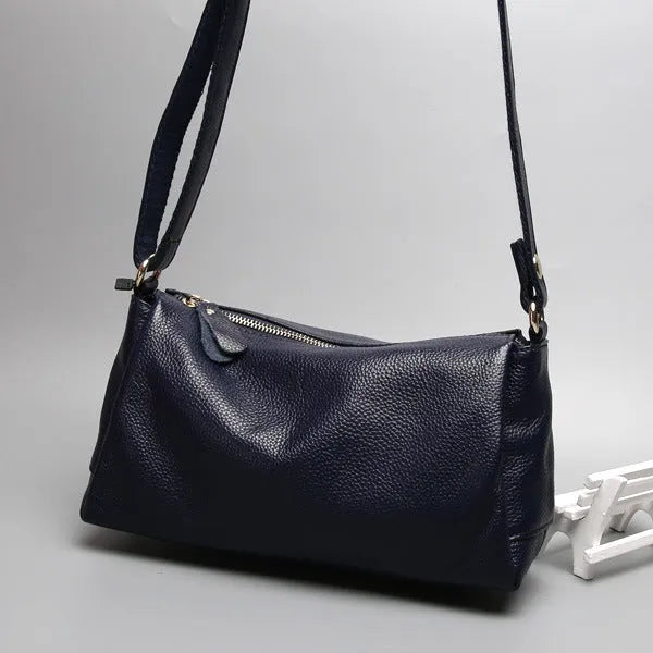 Soft genuine cowhide leather women's crossbody bag in horizontal square shape on a single strap.