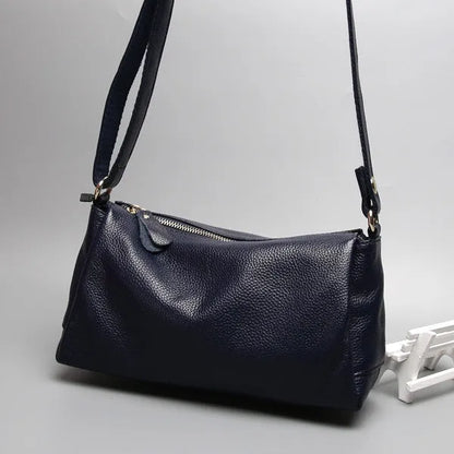 Soft genuine cowhide leather women's crossbody bag in horizontal square shape on a single strap.