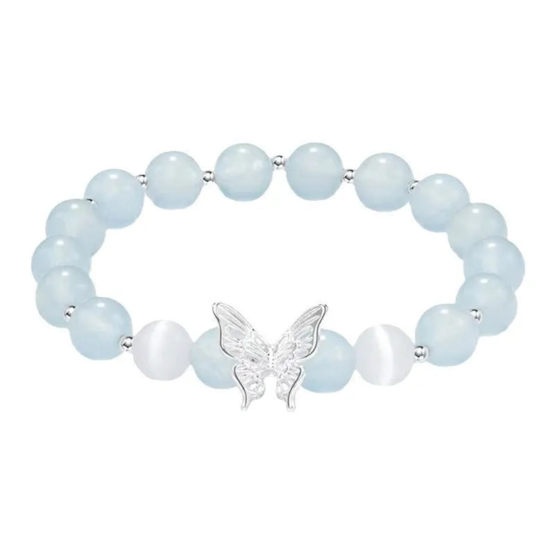 Women's crystal bow bracelet with butterfly design in ocean blue, pink, and purple colour options