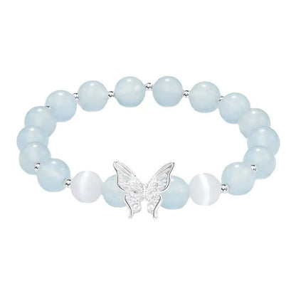 Women's crystal bow bracelet with butterfly design in ocean blue, pink, and purple colour options