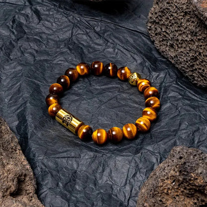 Little Lion ethnic geometric bracelet made from brown Bodhi seed beads on a wrist.