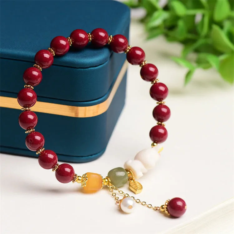 Traditional Chinese cinnabar bracelet with bunny design in purple-gold sand colour