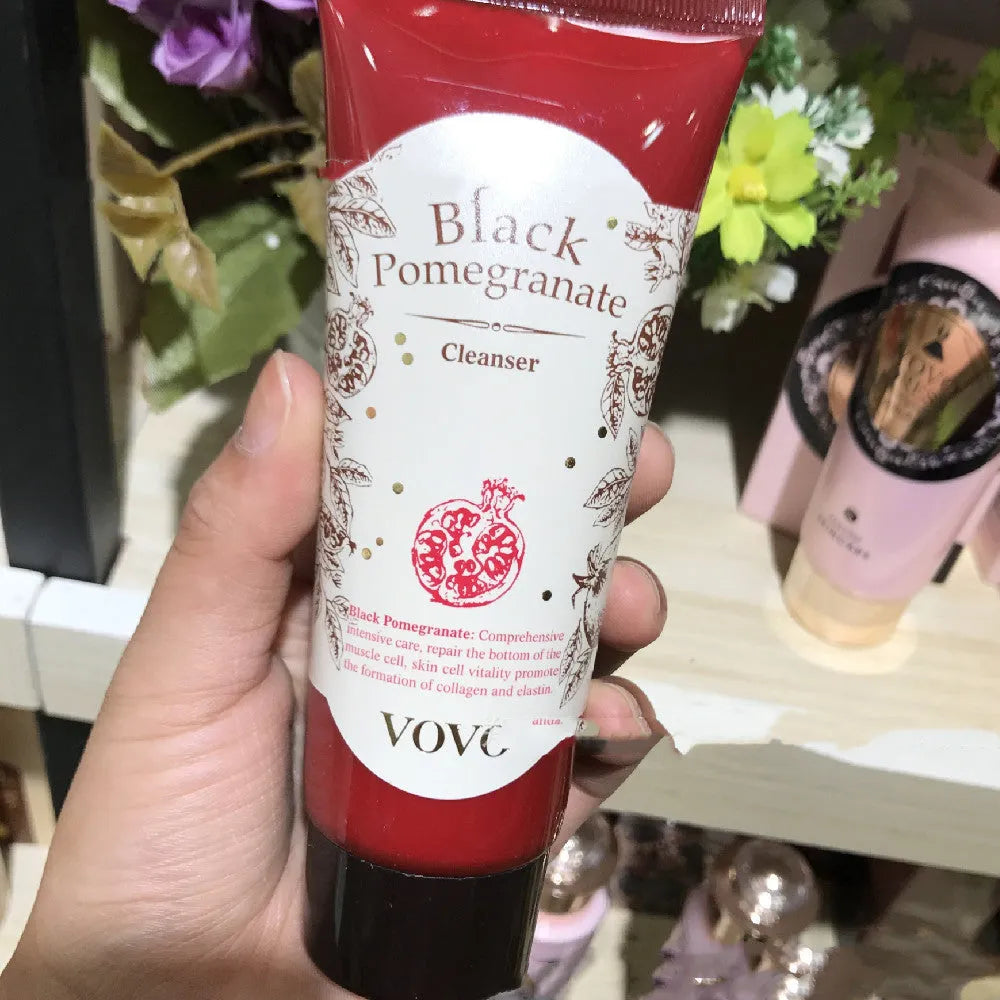 Six-piece pomegranate skin care set showing cleanser, milk, water, cream, essence, and eye cream products