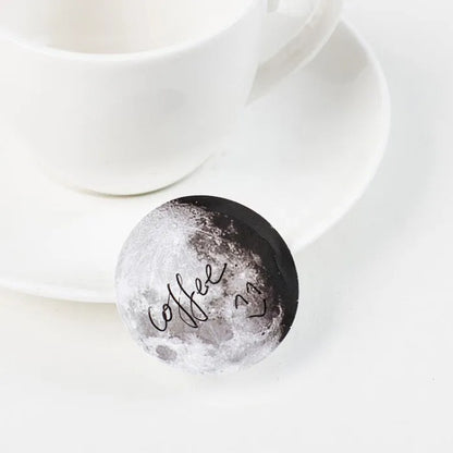 Box containing 45 black moon phases and calendar planet decorative stickers on self-adhesive paper.