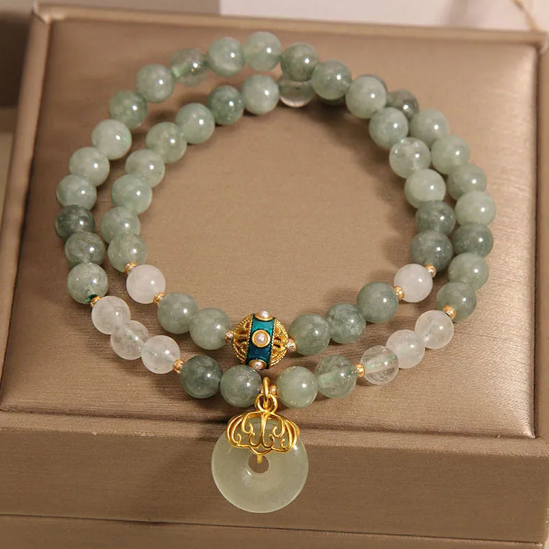 Women's aventurine double-layer jade bracelet with peace buckle closure and rhinestone details