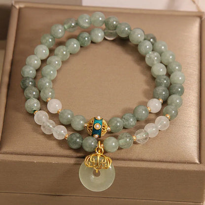 Women's aventurine double-layer jade bracelet with peace buckle closure and rhinestone details