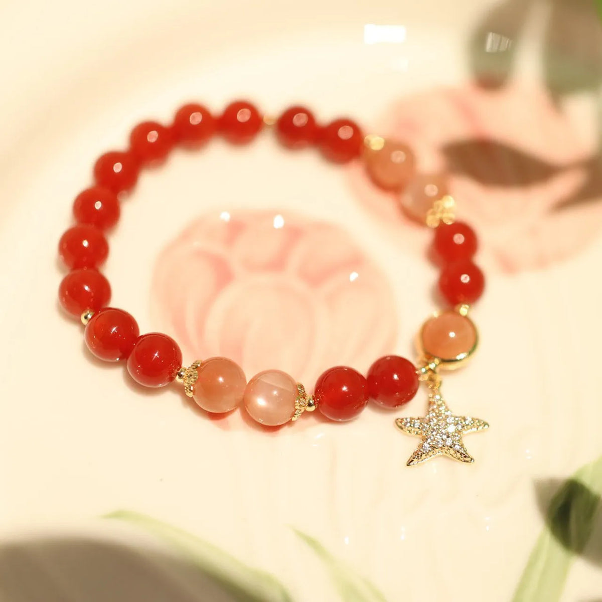 Handmade red agate and sunstone ethnic bracelet with star and Xiangyun designs for women