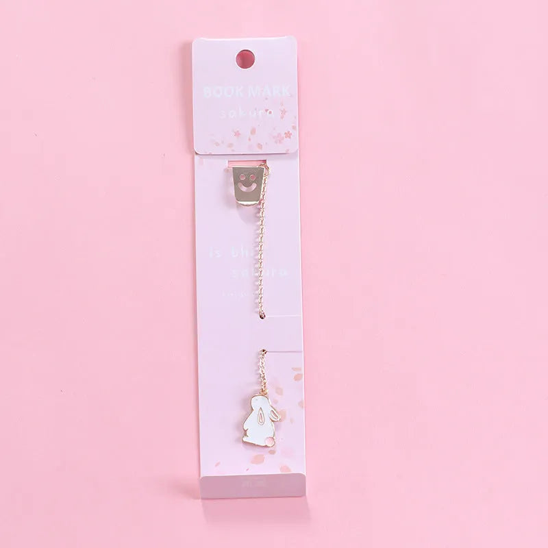 Alloy metal cartoon pendant bookmark with colourful charms including panda, rocket, and wishing bottle designs