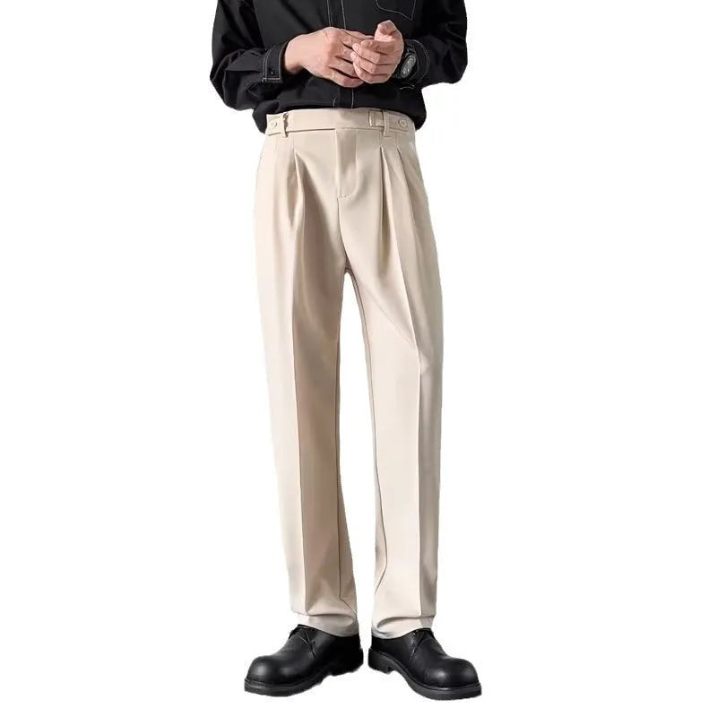 Men's straight-leg loose fit trousers in apricot and black colours, laid flat to show design.