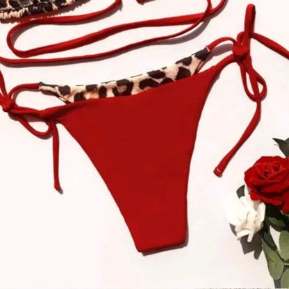 Women's leopard print halter neck bikini with front lace-up closure in black colour