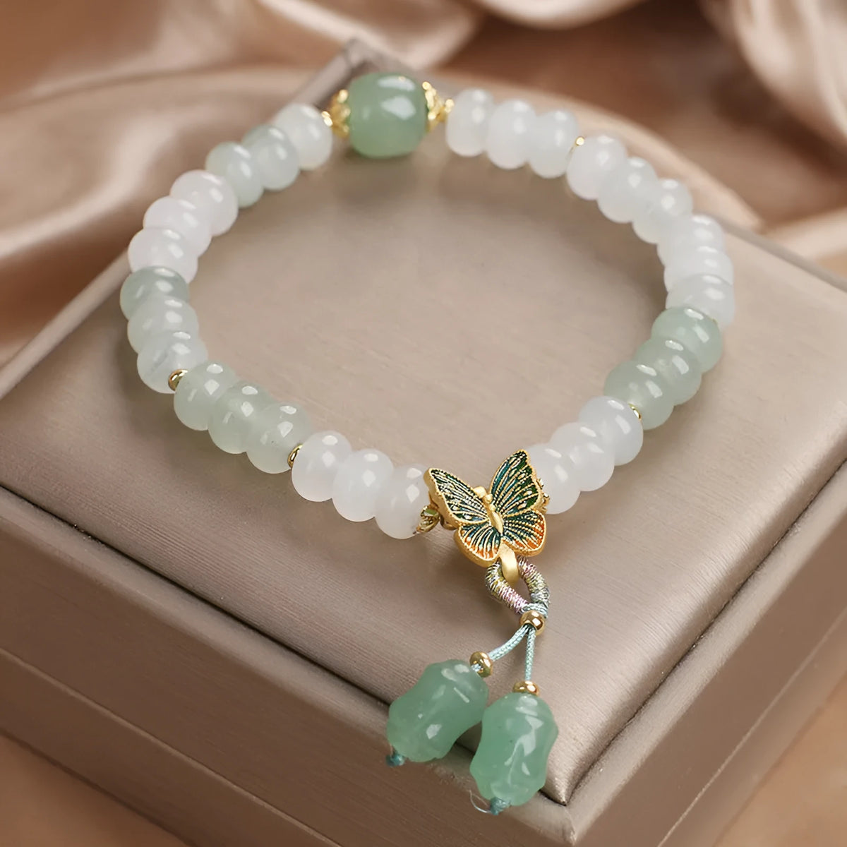 Green crystal abacus beads bracelet with retro butterfly charm and tassel decoration