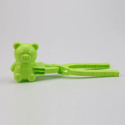 Red heart-shaped snowball maker clip for kids, perfect for winter play