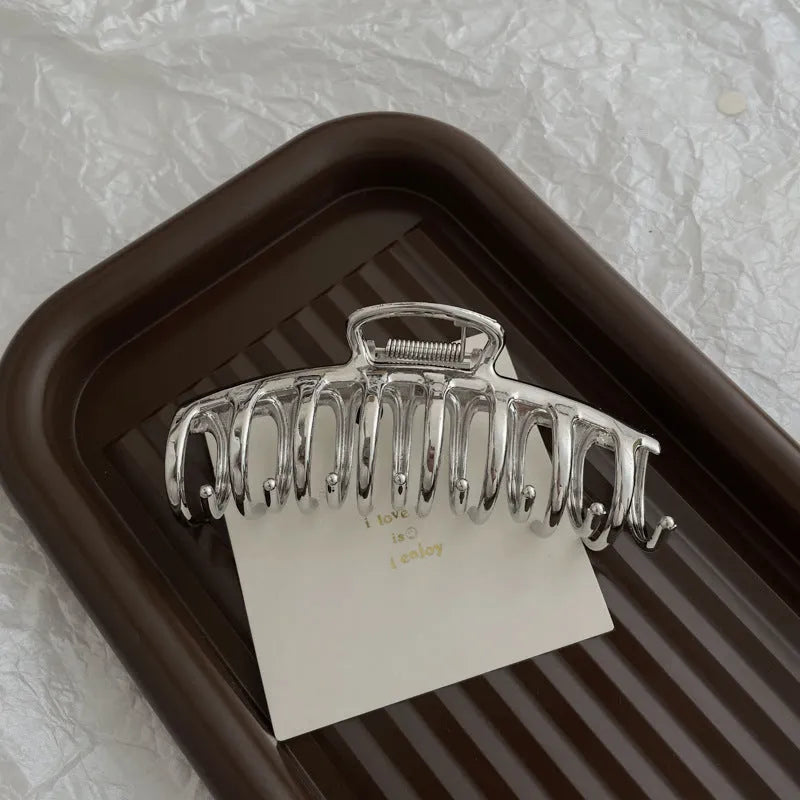 Silver metal hair claw barrette example from a range of 44 Korean-style designs.