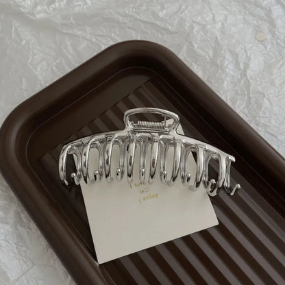 Silver metal hair claw barrette example from a range of 44 Korean-style designs.