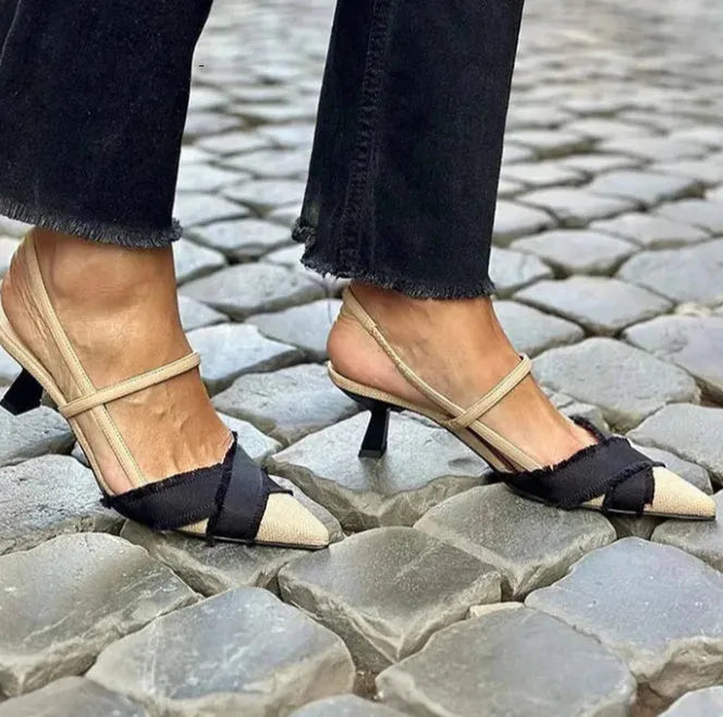 Women's apricot and black colour block pointed-toe sandals with a stiletto heel and an adjustable buckle fastening.