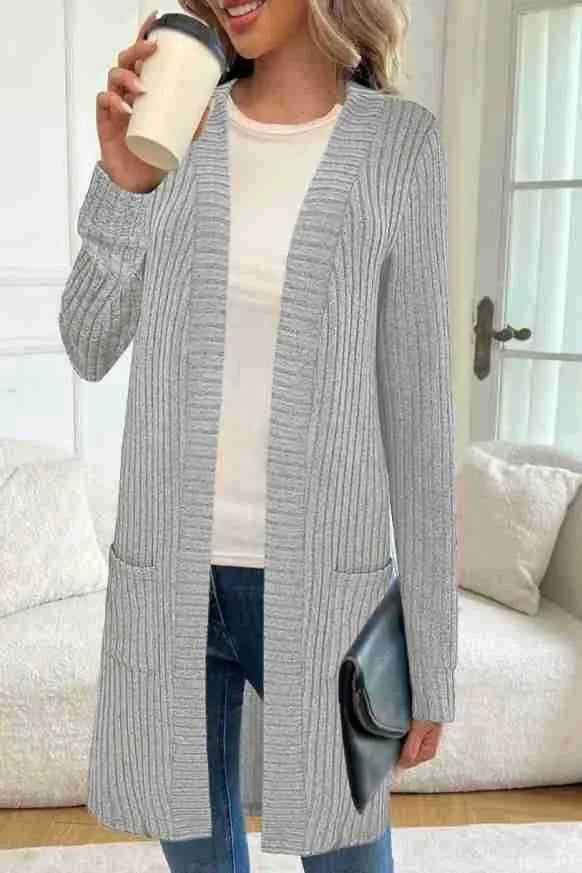 Long sleeve loose fit knitted cardigan jacket with side pockets, shown in grey.