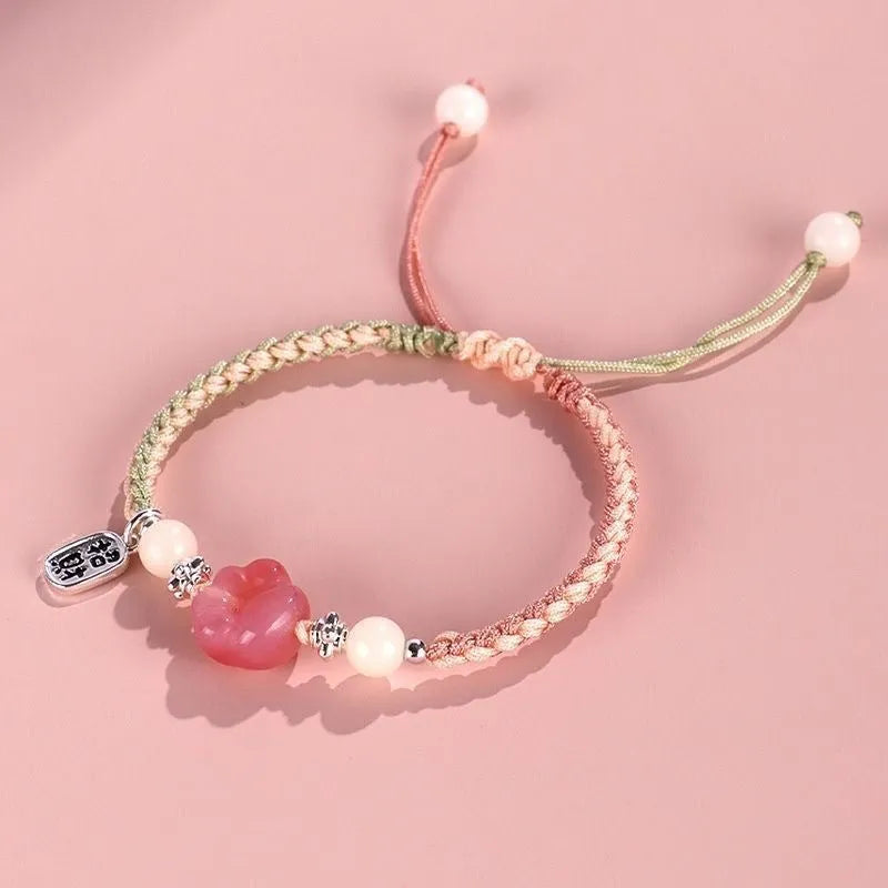Handmade red cat's paw charm bracelet with glass beads in pink or yellow woven design