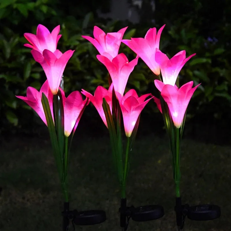 Colourful solar-powered LED lawn lamp in a flower shape for garden decoration.