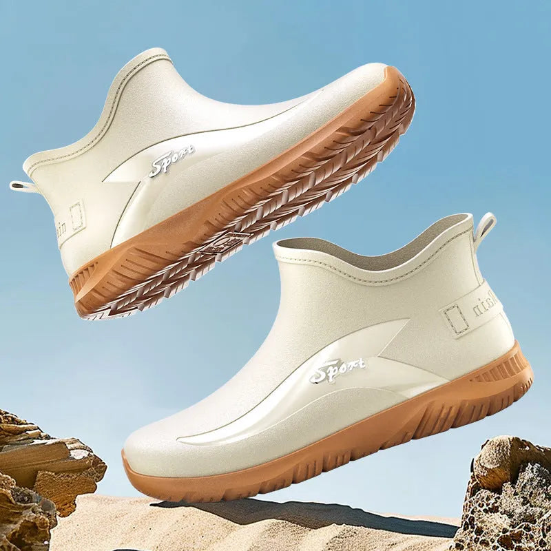 Men's short PVC rubber boots in beige, black, and black-red colours with a non-slip flat sole.