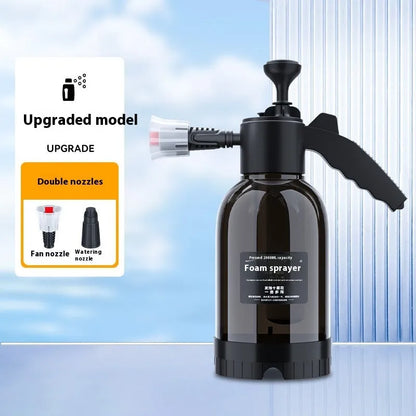 Black 2-litre hand-held foam sprayer with pump handle, shown with two nozzles for car washing and garden use.
