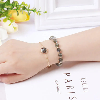 Double-layer women's bracelet with lucky beads and colourful crystals in gold-toned setting