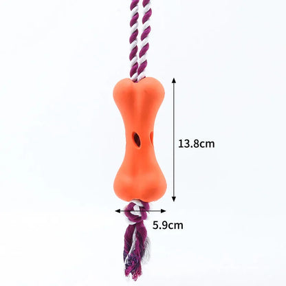 Green porous bone dog toy with knotted rope, hollow for treats, measuring 138mm