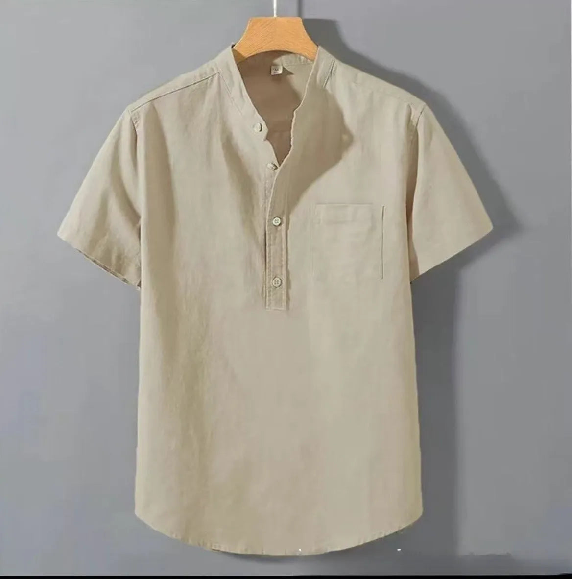 Men's casual beige linen-cotton shirt with stand collar and short sleeves on a hanger