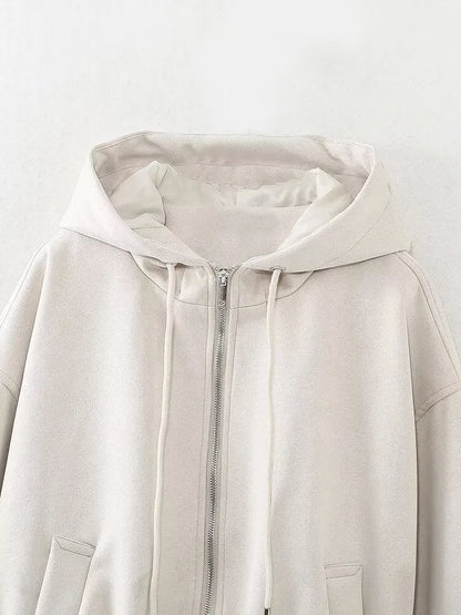 Women's casual hooded suede jacket in black colour on a hanger.