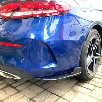 Car rear corner protectors in PP plastic, shown in piano black and carbon fibre pattern finishes