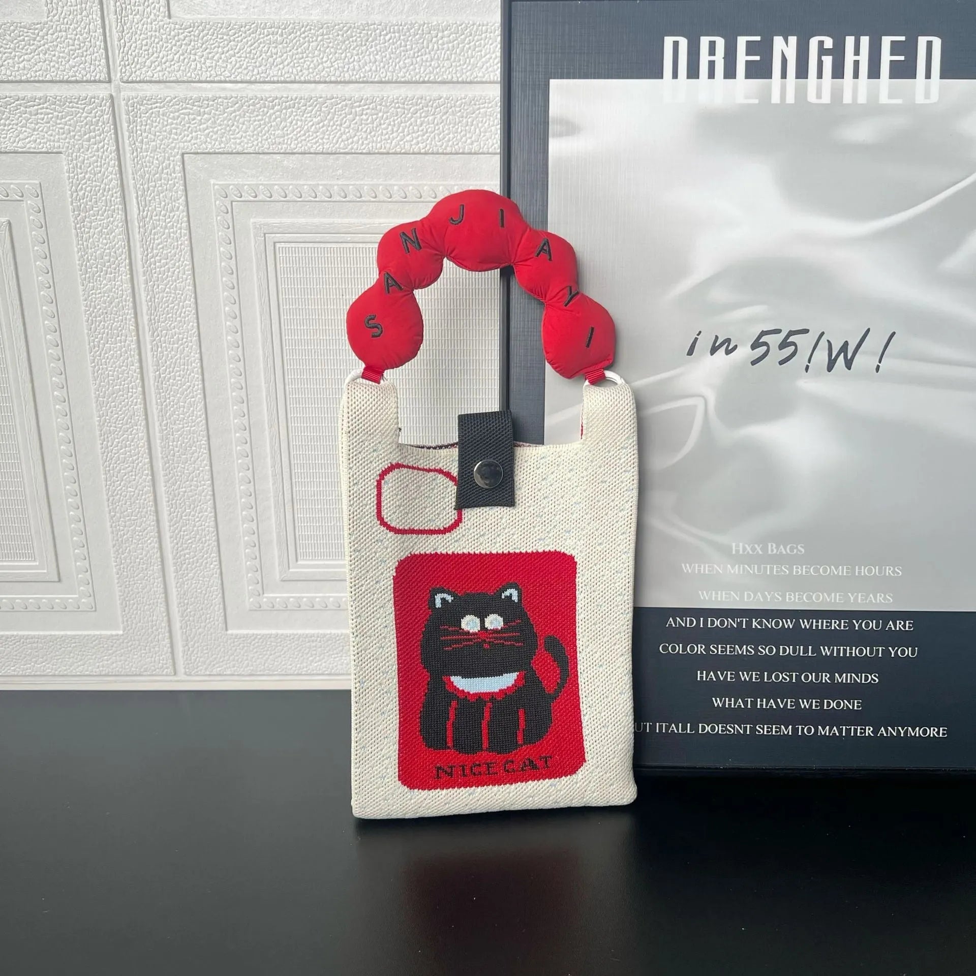 Cartoon knitted messenger bag with polyester construction and internal mobile phone storage