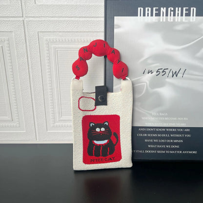 Cartoon knitted messenger bag with polyester construction and internal mobile phone storage